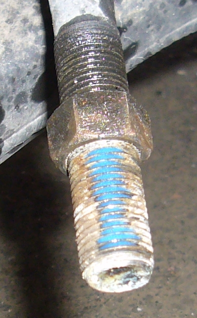 clean oil and rust off the thread, then apply medium-strength threadlocker